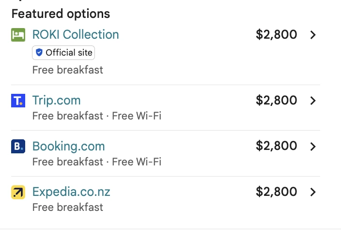 Google's Featured options panel showing ROKI Collection's own official-site rate at $2,800, listed above Trip.com, Booking.com and Expedia at the same price